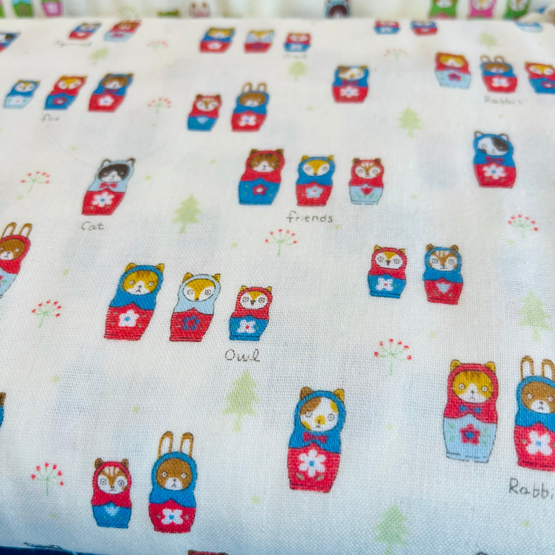 Matryoshka Animals - Nesting Dolls on Off White with Blue and Red on Double Gauze from Kokka